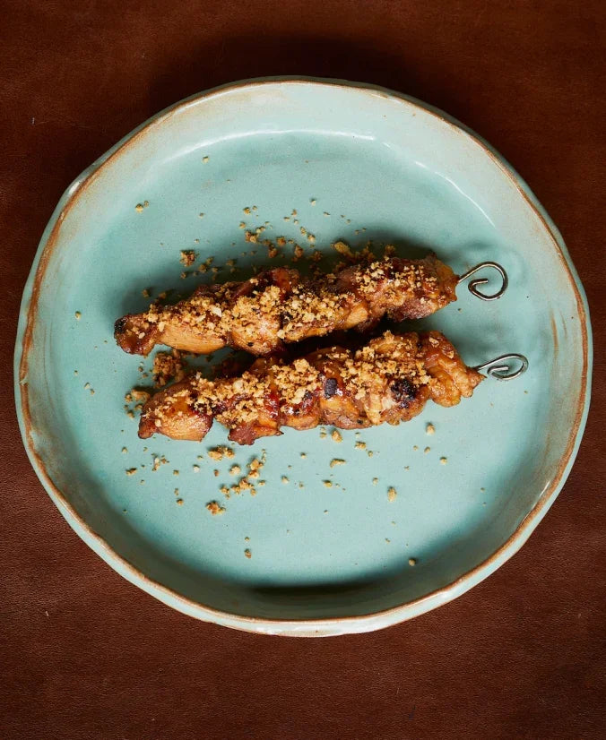 Chicken yakitori with Asian glaze and hazelnut crumble