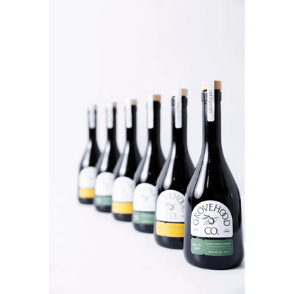 Grovehood Collective Extra Virgin Olive Oil bottles in a row
